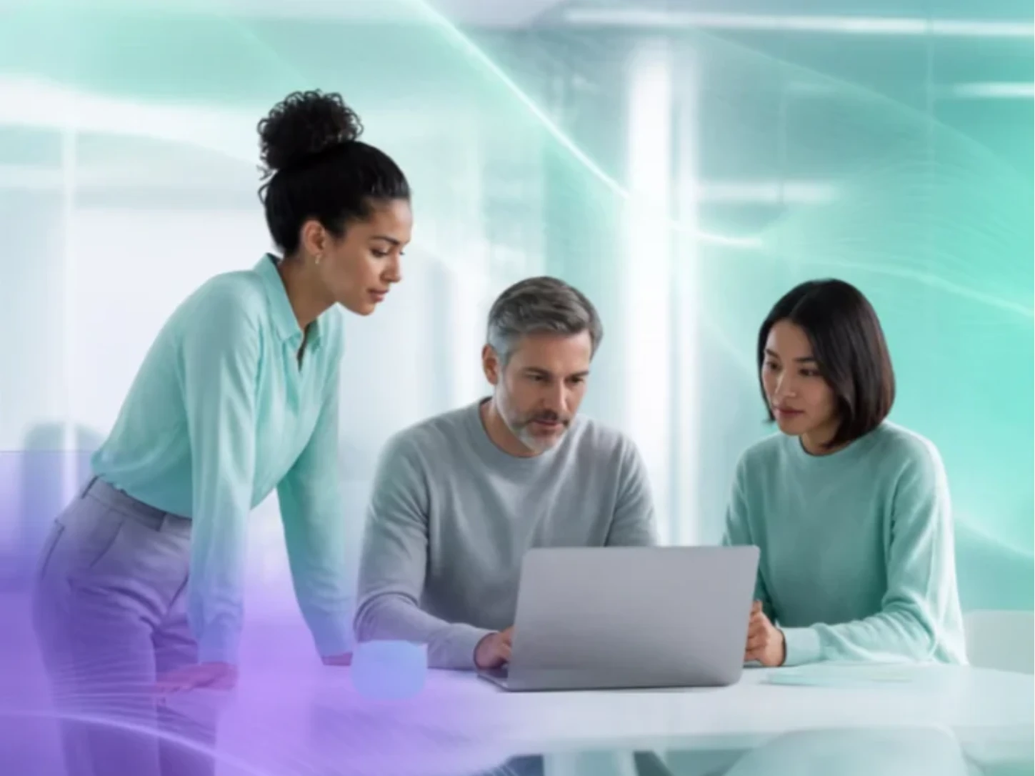 Three colleagues reviewing a laptop together in a bright office, with a teal and purple abstract data visualisation overlay.